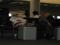Old couple waiting for flight