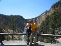 We asked this to take out picture with the waterfall in the background - I guess she really thought to put the waterfall in the back of us. It's still a nice shot though - Yellowstone is that beautiful.