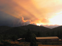 This is the begining of the Oregon fires near the border - You can just see the smoke coming up from the mountains - makes for a nice sunset