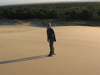 Natty standing in the wind on the sand dunes